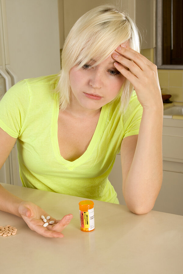 bigstock-Young-Blond-Woman-With-Medicin-12068330.jpg